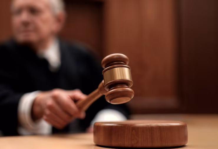 Judge&rsquo;s gavel resting on a courtroom bench during a civil court proceeding