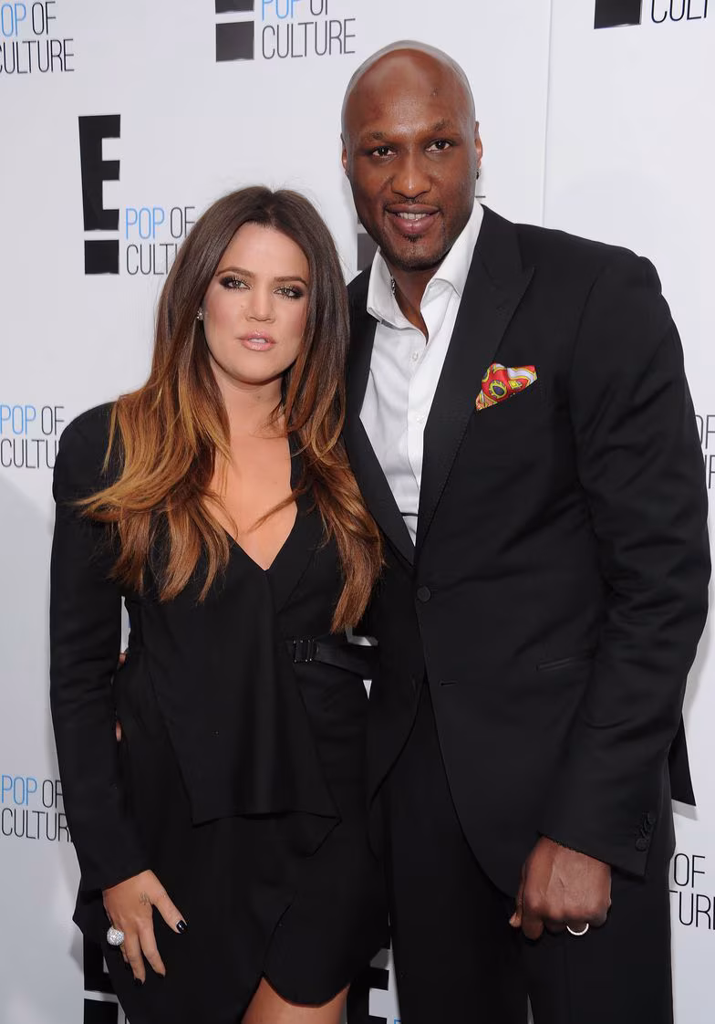 Lamar Odom and Khloé Kardashian pictured together at a public event during their former relationship