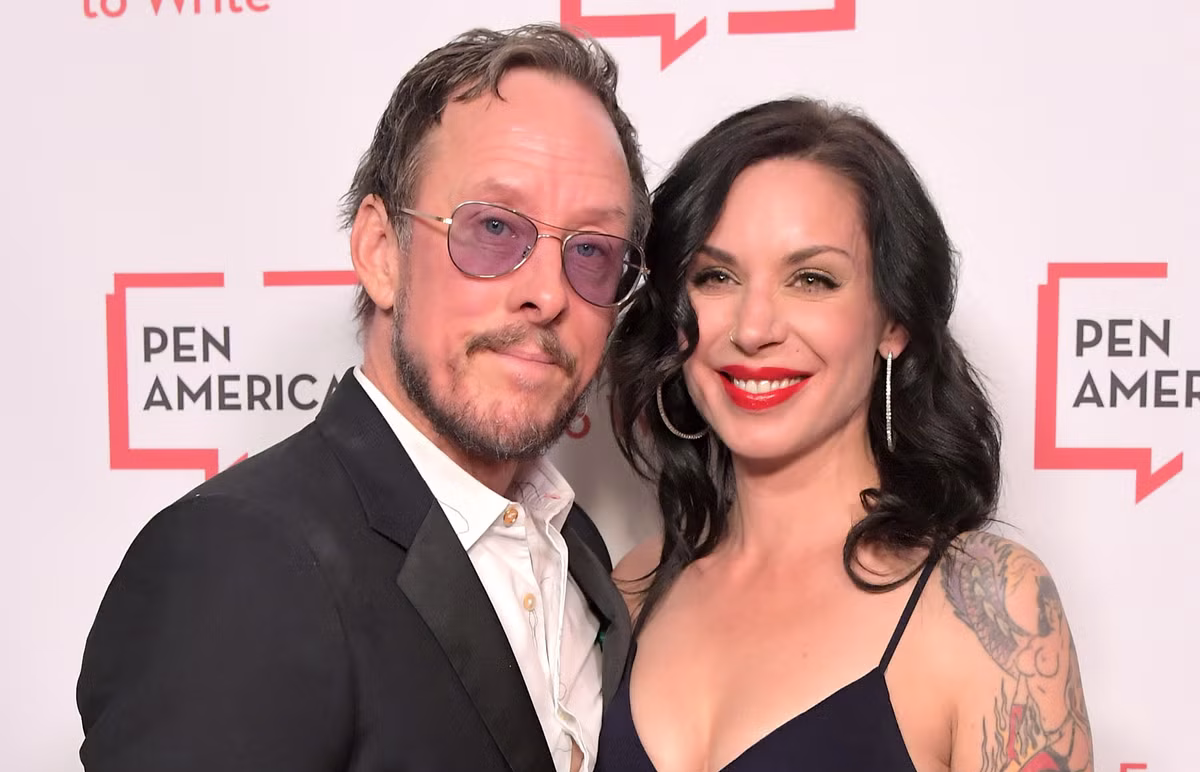 Scott Shriner and Jillian Lauren posing together at a public event