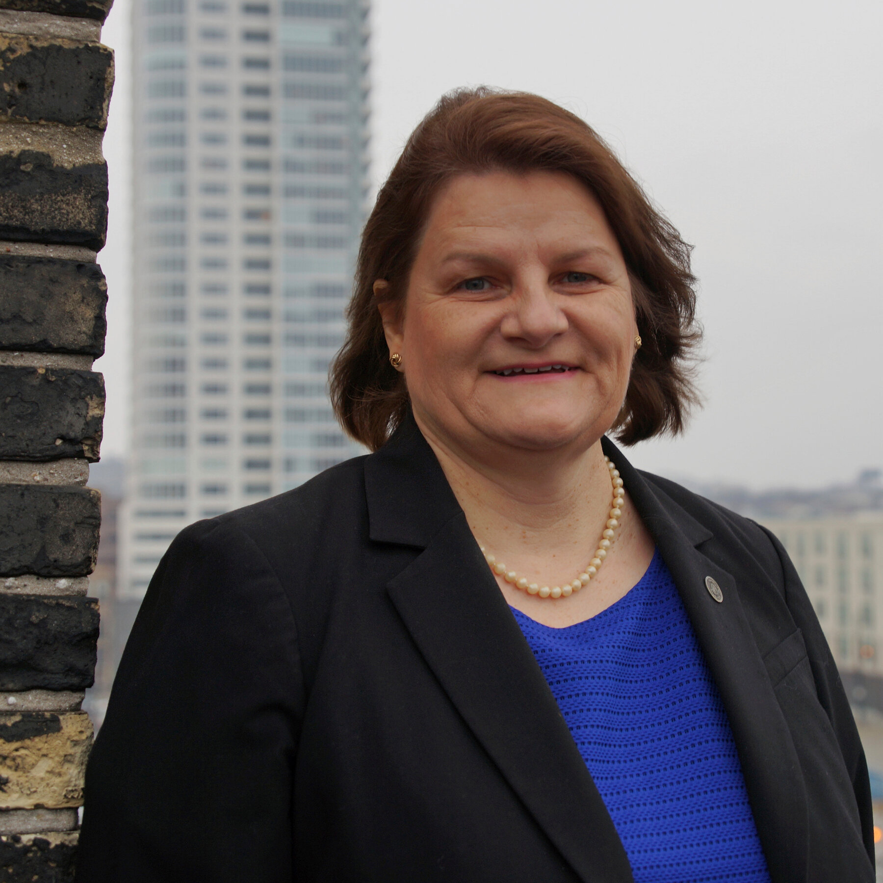 Milwaukee County Circuit Court Judge Hannah Dugan wearing a black blazer and pearl necklace. This portrait anchors the analysis of her January 2026 resignation following a federal obstruction conviction.