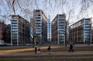 Exterior view of the One Hyde Park residential development in London, showing modern glass-fronted apartment buildings facing Hyde Park.
