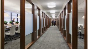 Empty law firm office corridor reflecting partner departures and operational disruption