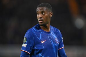 Tosin Adarabioyo in a Chelsea shirt during a match.