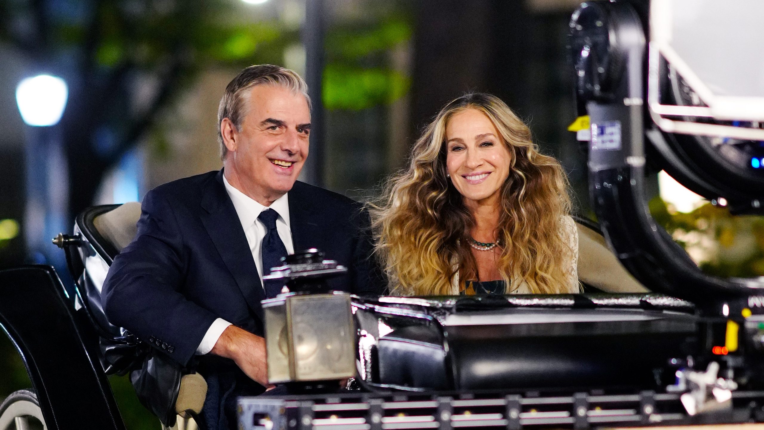 Chris Noth and Sarah Jessica Parker filming a scene together at night in New York City