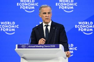 A political leader speaks at a podium during the World Economic Forum Annual Meeting in Davos, 2026.