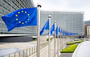 European Commission headquarters in Brussels with EU flags