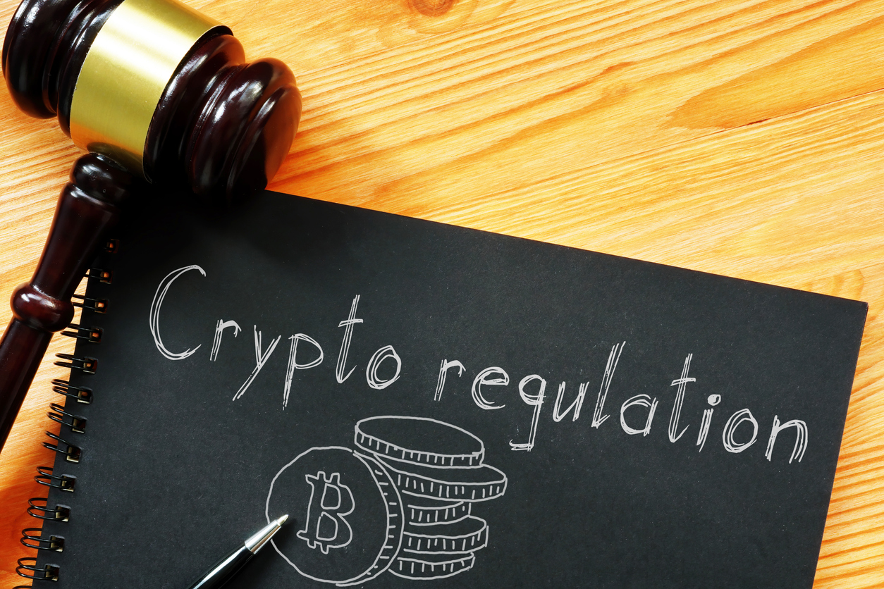 crypto regulation is shown on the business photo using the text
