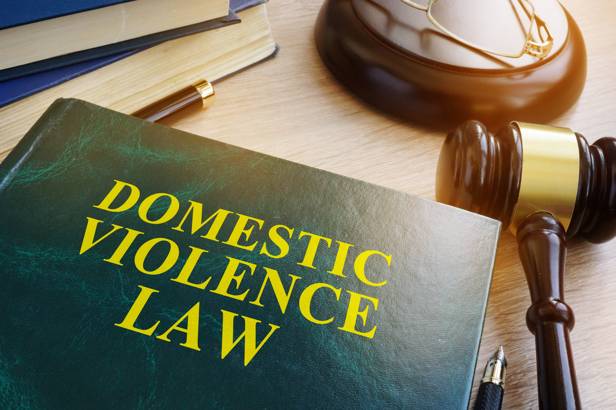 domestic violence law on a wooden table.