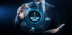 A business professional interacts with digital legal icons, including scales of justice, courthouse, magnifying glass and contract symbols, representing LegalTech and modern legal services.