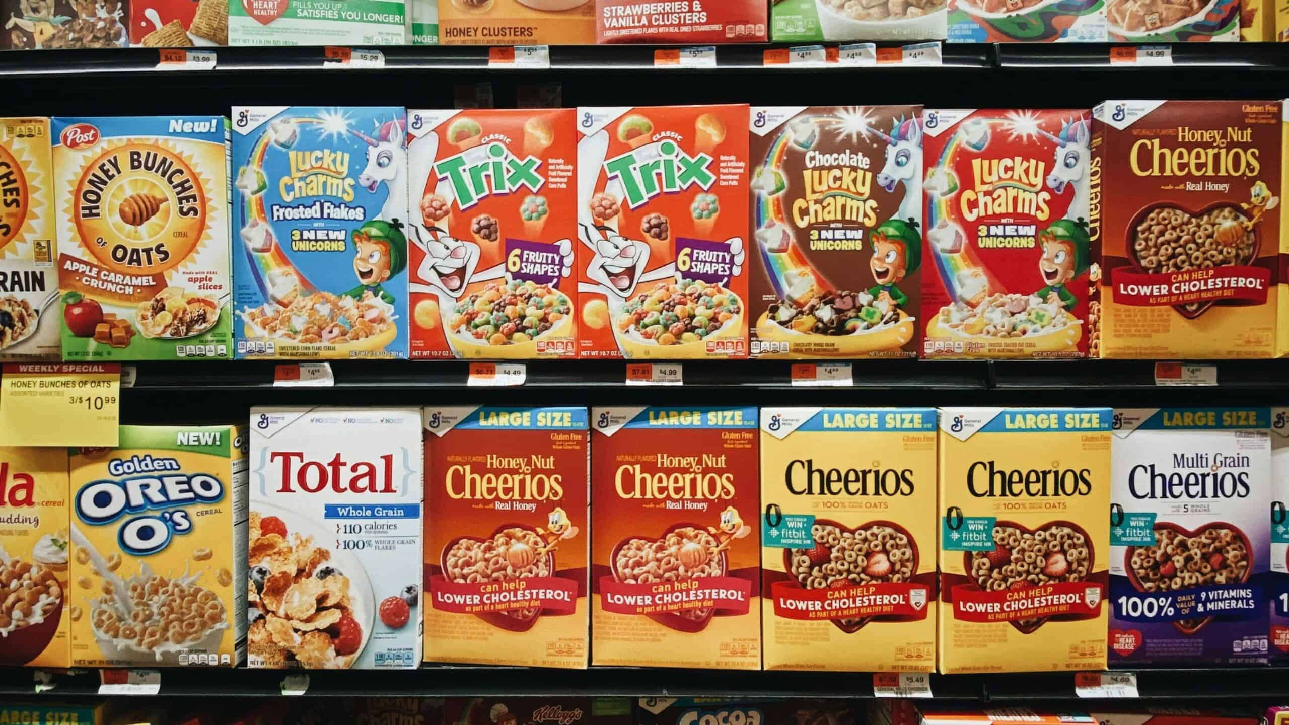 Supermarket aisle with packaged snacks and cereal products on shelves
