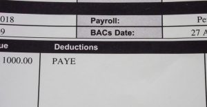 UK payslip showing PAYE tax code used to calculate income tax