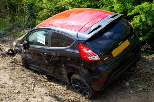 A car in a ditch after an accident.