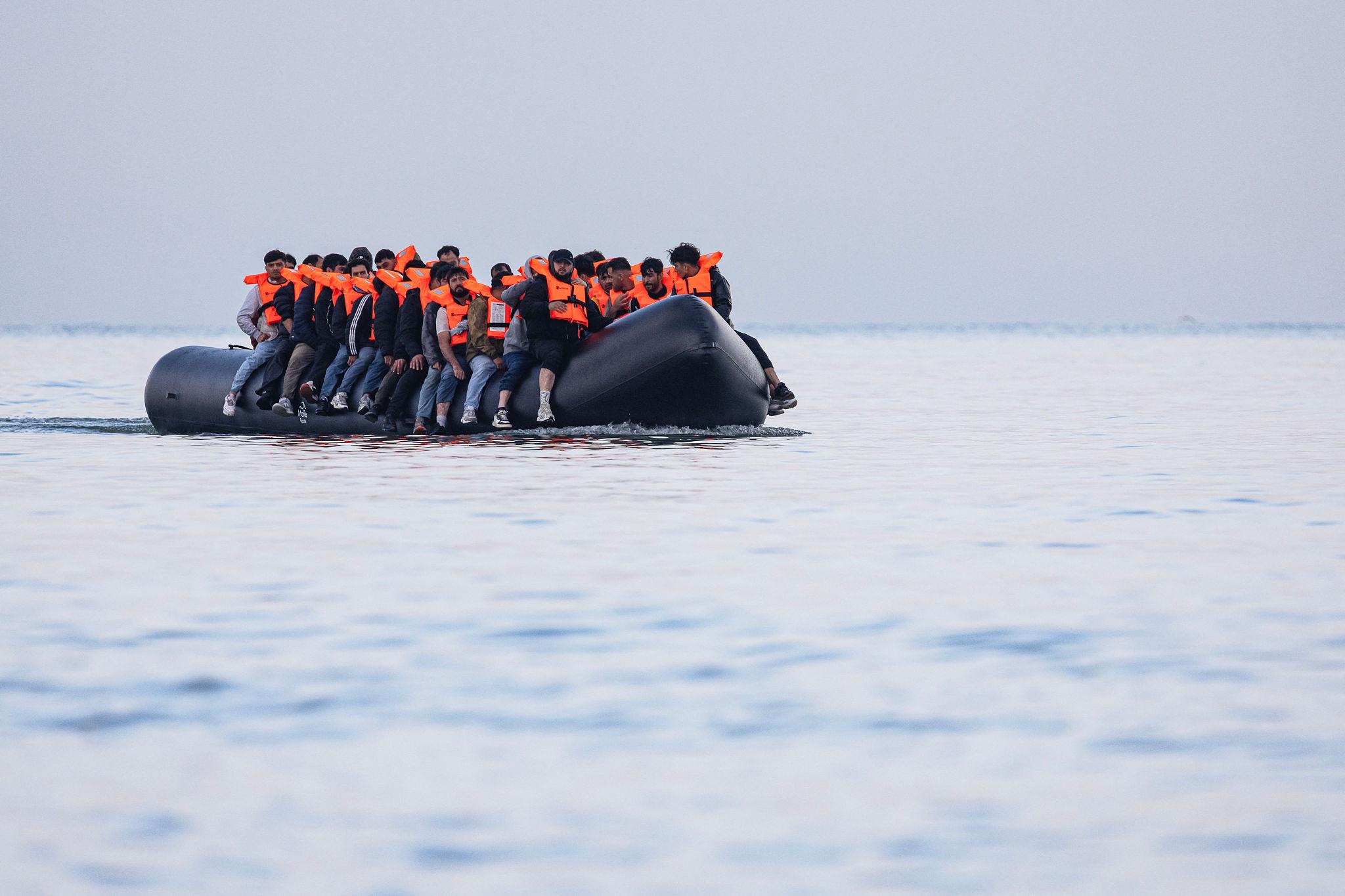 UK migrant boat crossing the English Channel during asylum migration crisis
