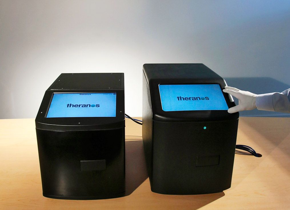 Promotional image of the Theranos Edison device, central to its unfulfilled promise of revolutionary blood testing